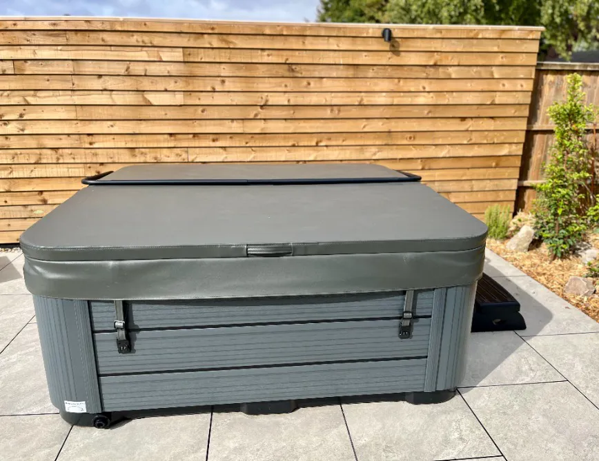 Hot tub cover lift showing how to open and secure the cover